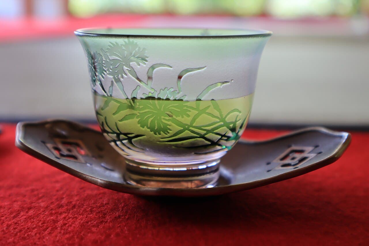 A glass of chilled fukamushi (deep-steamed) sencha from Kakegawa, Shizuoka — the pale golden-green liquor typical of cold-brewed Japanese green tea