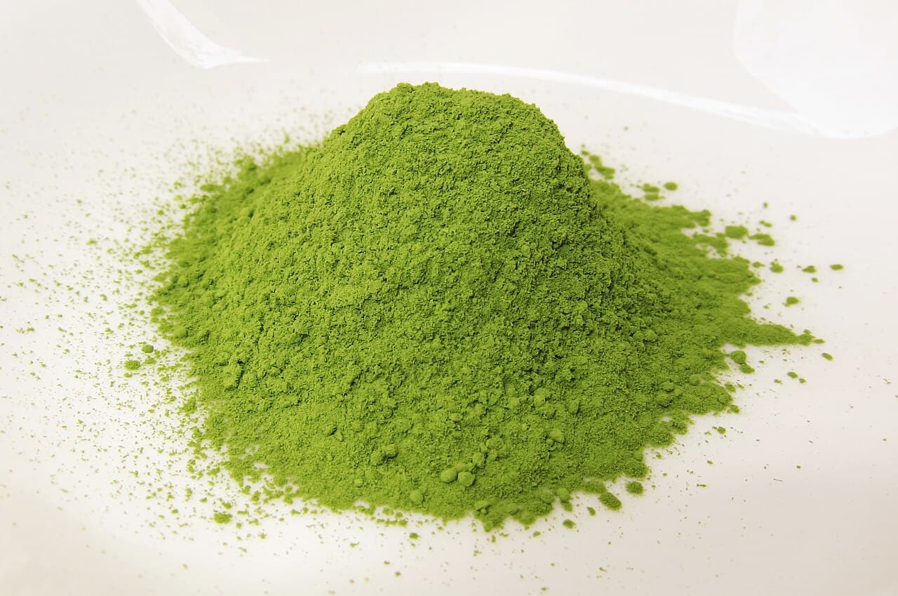 A bowl of whisked matcha showing its foam and deep green colour