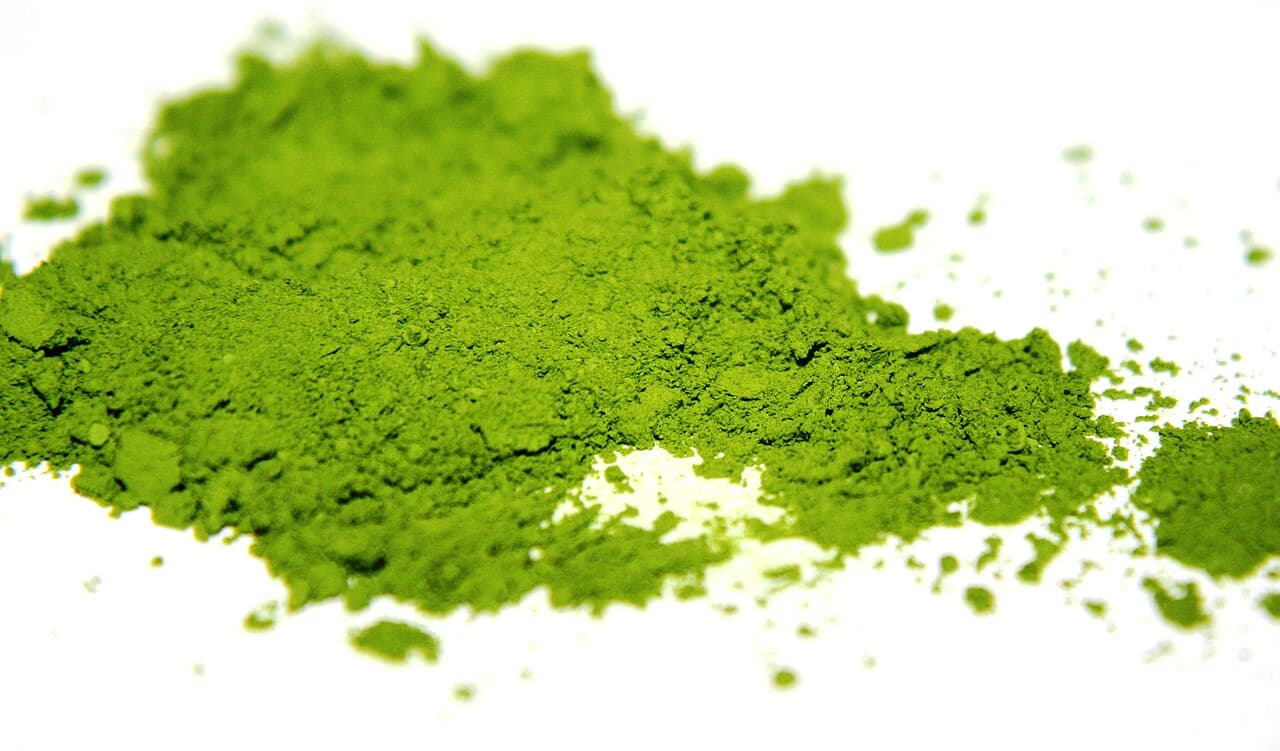 Close-up of fine, vivid green matcha powder